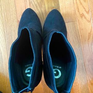 Black Suede booties by Guess. Size 9.5M. Has a zipper in the back.